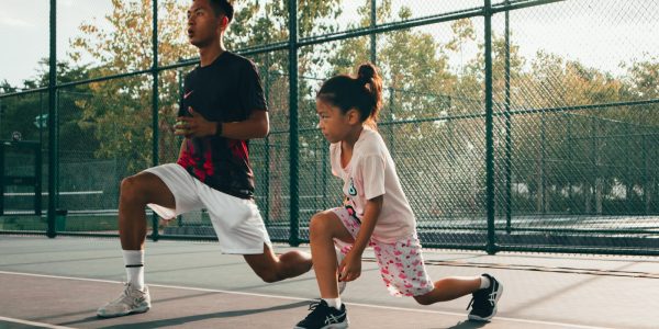 a man and a woman playing tennis on a court